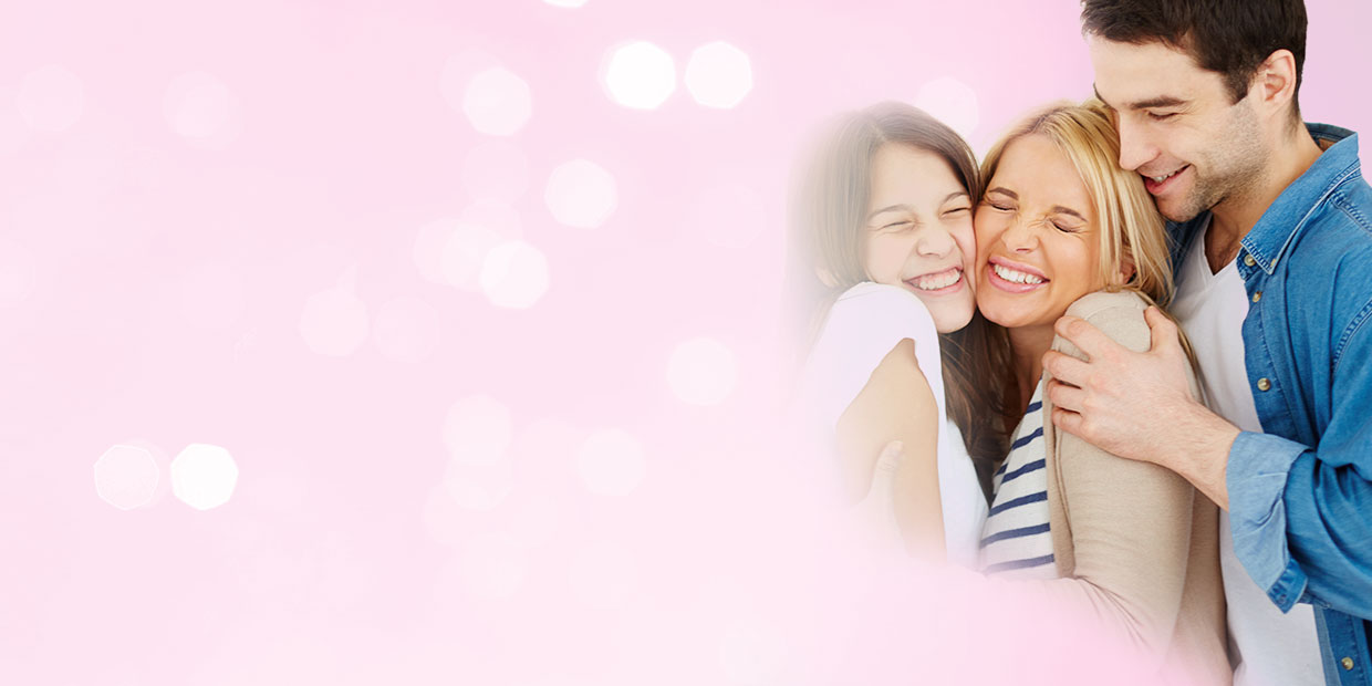 A smiling family hugging